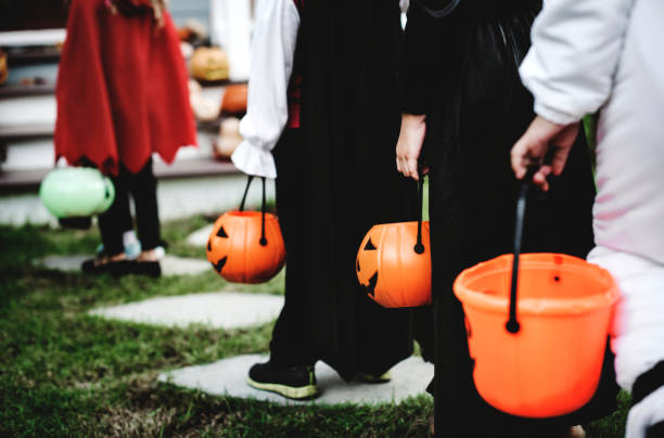 Little children in Halloween costumes